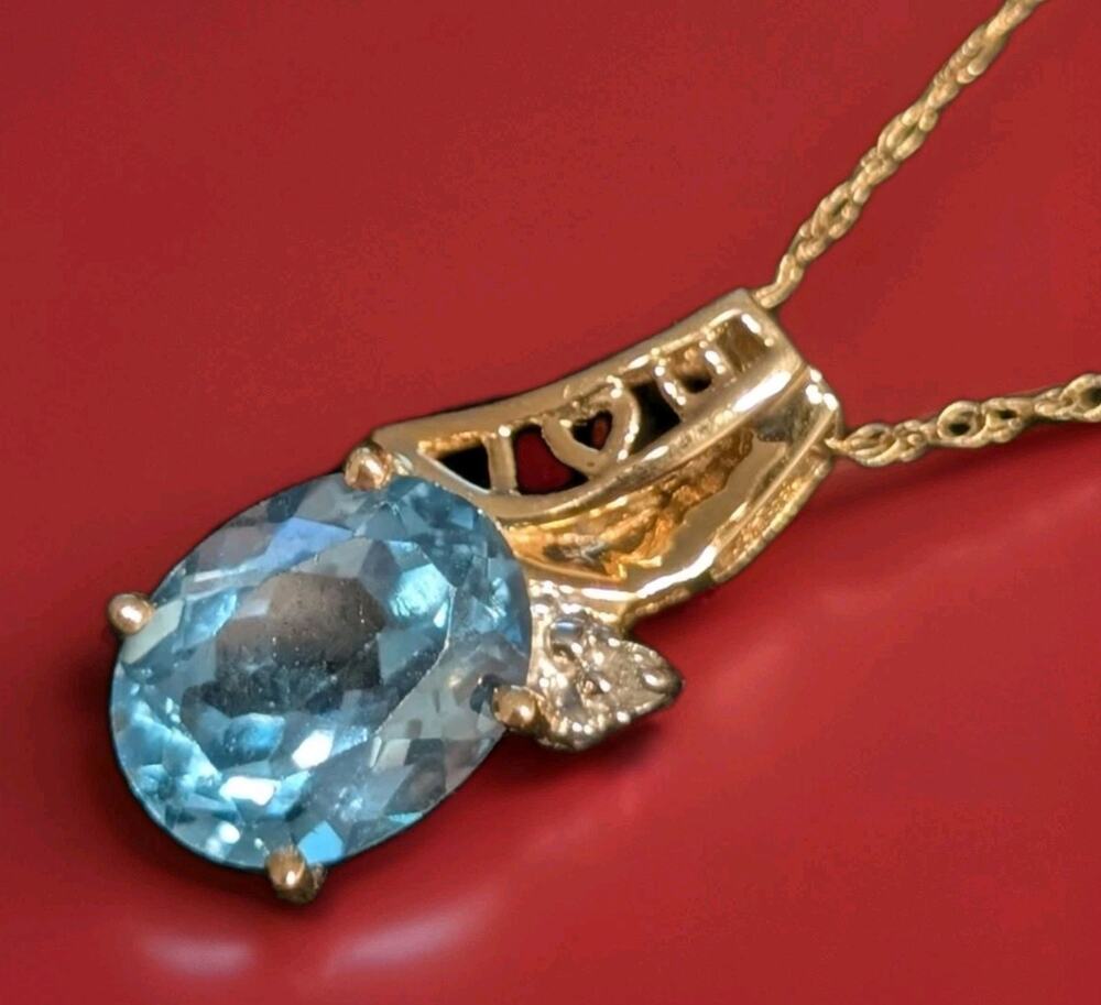 SOLID 10K GOLD PENDANT ON 18" NECKLACE BLUE TOPAZ AND DIAMOND ACCENT "I Love U"